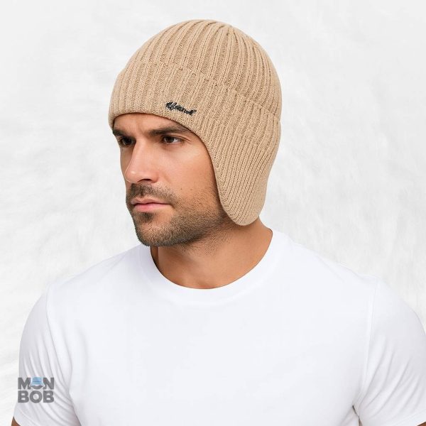 Accessoire chaud en beige, idéal pour protéger les oreilles du froid