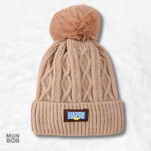 Bonnet beige à pompon pour un style tendance et confortable